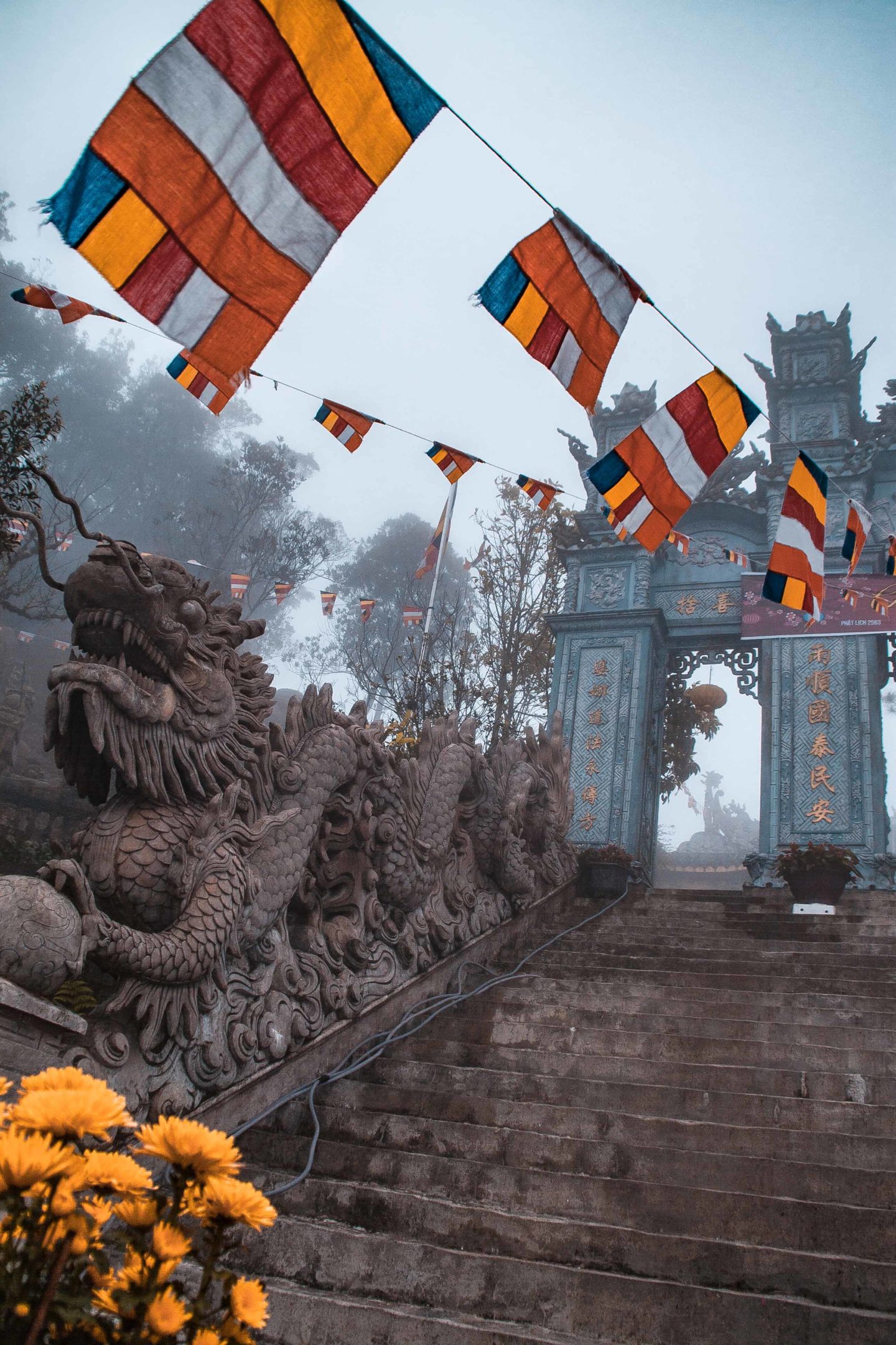 Architecture and flags on a Buddhist temple in the Ba Na Hills, Da Nang