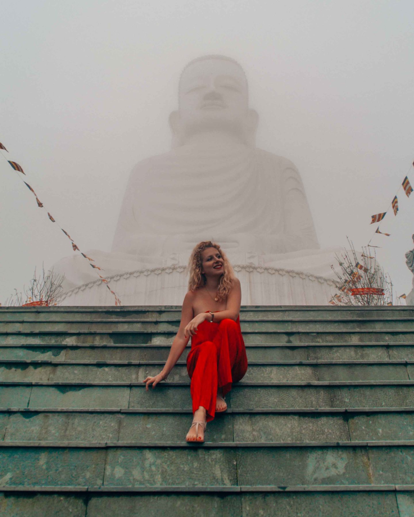Mist around a sitting buddha in the Ba Na Hills, Da Nang